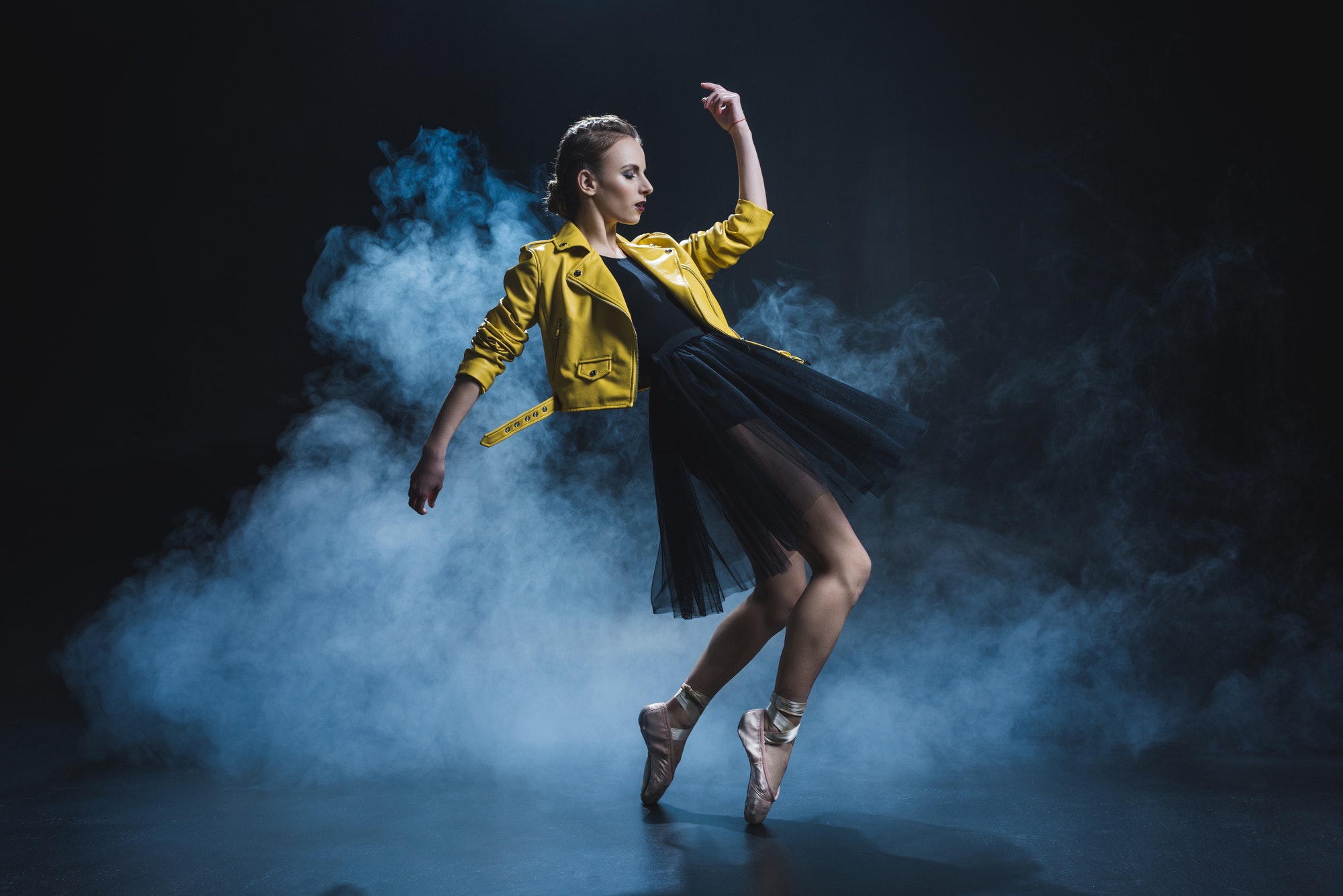attractive-girl-dancing-in-pointe-shoes-and-black-tutu-and-yellow-leather-jacket-in-studio-with.jpg